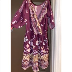 Size Medium wine colored/floral romper with open shoulders. Small front tie
